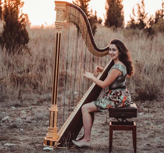 nadine-mhanna-playing-harp-in-nature